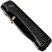 Baby Banter Wharncliffe Folding Knife displayed with black handle and Wharncliffe blade. A compact and reliable EDC tool for various tasks. 